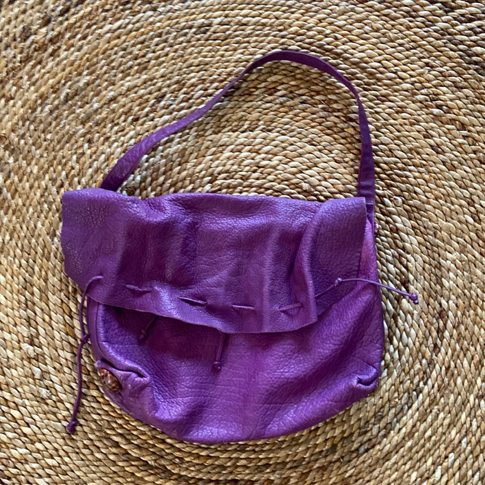 Carlos Falchi purple handbag.